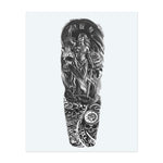 A blindfolded warrior stands with a sword, framed by a clock, skulls, and swirling roses. Snakes writhe at their feet, while clocks and Gothic ornaments spin beneath. This tattoo symbolizes justice, mortality, and the relentless power of fate.
